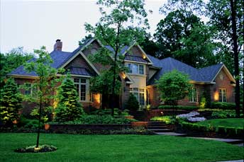 Photo of home with outdoor lighting